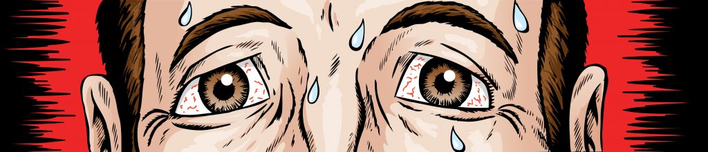 Close up of a nervous man's concerned eyes with sweat rolling down his face