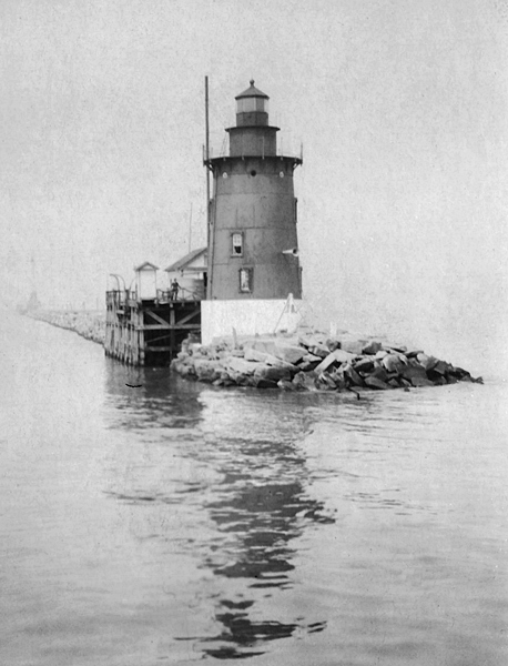 A black and white photo of the Breakwater East End Lighthouse from 1925